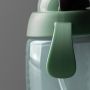 Close up of weighted straw cup on a dark grey background