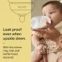 Baby drinking from a Natural Start baby bottle