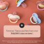 Flat-lay of the Ultimate Fit pacifier range with a 5-star review statistic overlay.