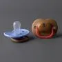 A blue and brown anytime soother laid out against a grey background
