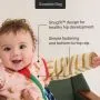 Baby wearing a Swaddle Bag with their arm out with feature text.