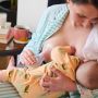 Parent breastfeeding and expressing with the silicone breast pump.