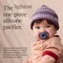 Baby with Ultra-light Stayput pacifier next to feature text.