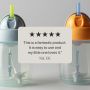 Blue and orange trainer straw cups against a grey background with text overlay of customer review