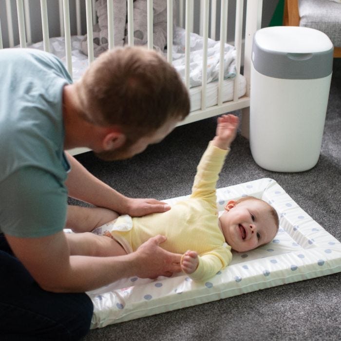 Dad changing baby using Twist and Click Bin 