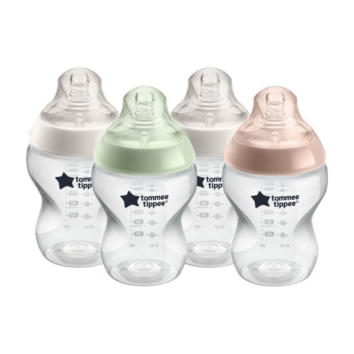 4 Closer to Nature baby bottles with various coloured screwrings on a white background