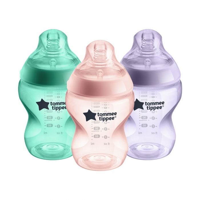 3 Closer to Nature baby bottles in green, pink and purple on a white background.