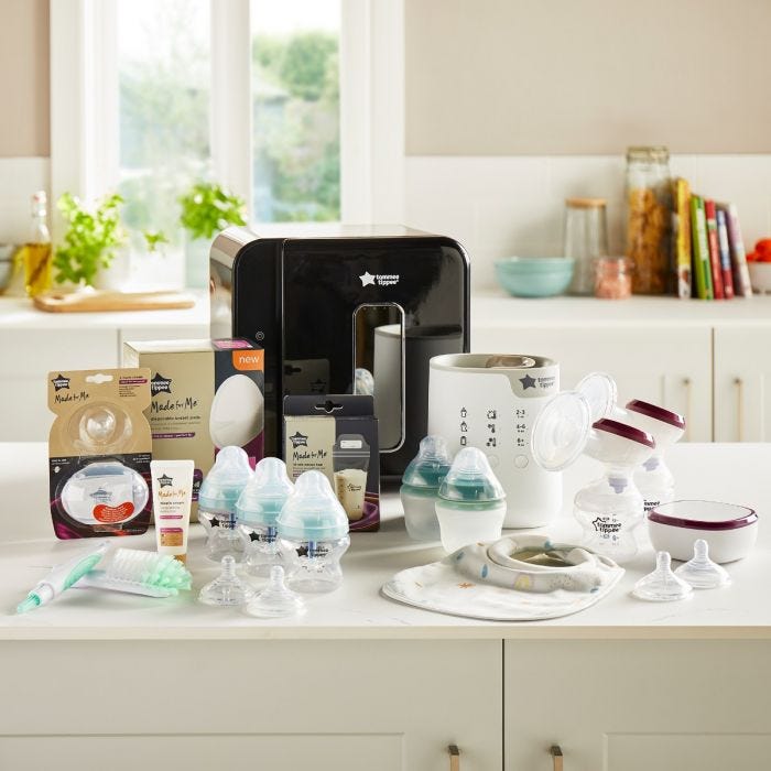 Products included in the ultimate breastfeeding bundle. Including steriliser, perfect prep machine and bottles in kitchen.