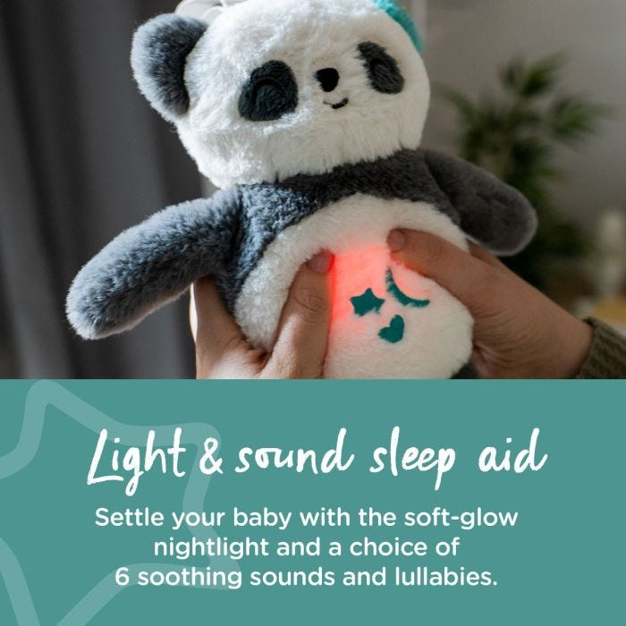 Panda sleep aid illuminated and attached to cot with text stating that it is a light and sound sleep aid.