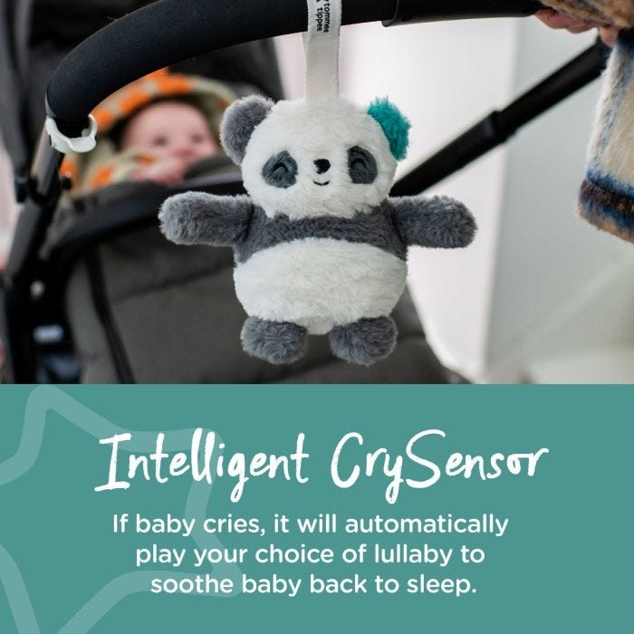 Baby in pram with Panda mini sleep aid attached to the handle next to text stating that it has a crysensor.