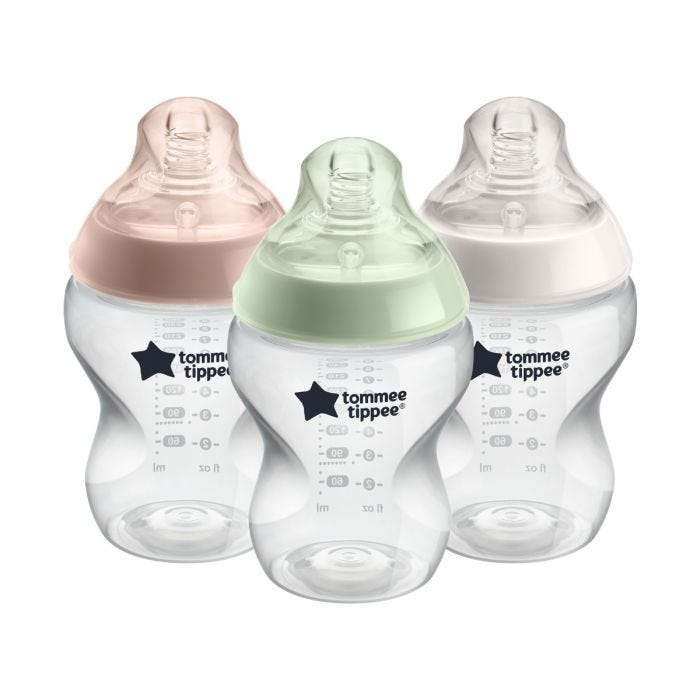 3 Closer to Nature baby bottles with different coloured screwrings on a white background