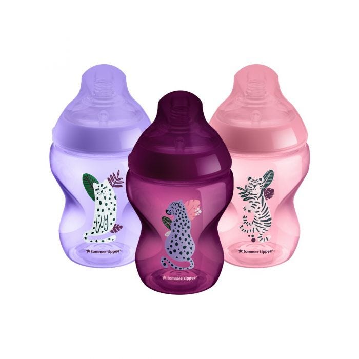 3x 260ml pink, lilac and purple Closer to Nature baby bottles on a white background.