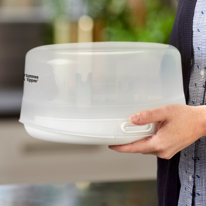 Someone carrying the microwave sterilizer