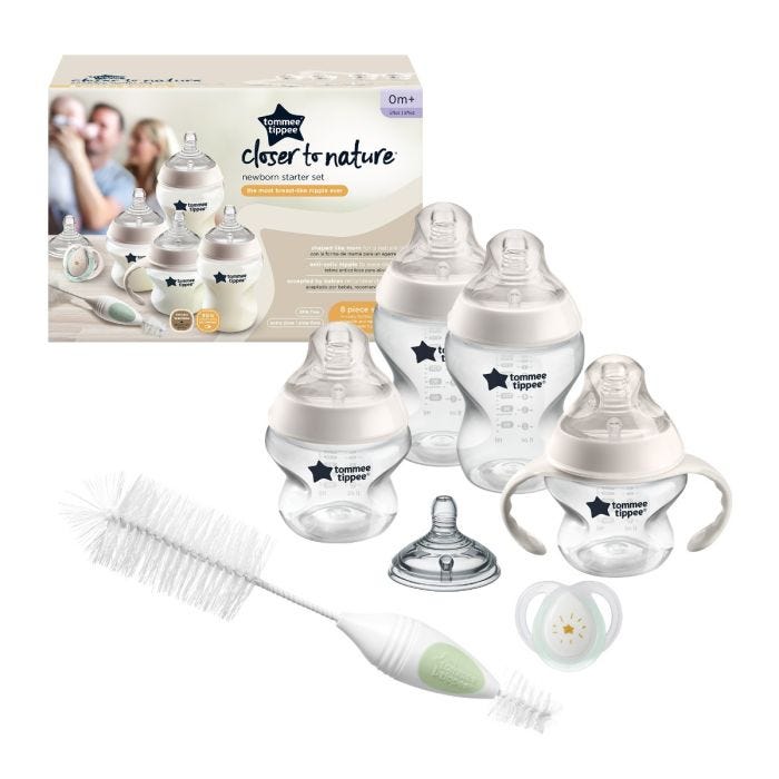 Closer to Nature Baby Bottle Newborn Feeding Gift Set next to packaging on white background.