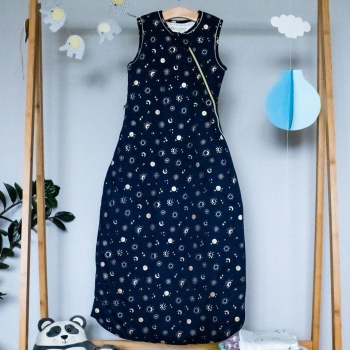 The Original Grobag Moon Child Sleepbag hanging on rail in nursery