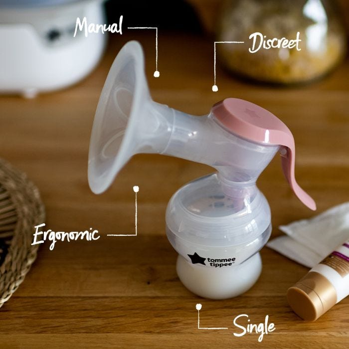 Tommee Tippee Manual Breast Pump placed on kitchen counter with pointers saying single, ergonomic, manual and discreet.