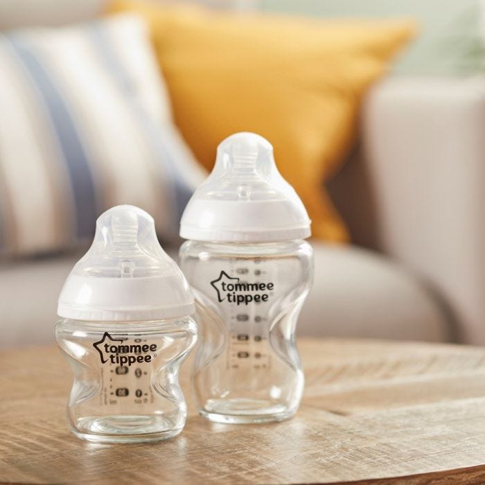 Clear baby bottles on a table 