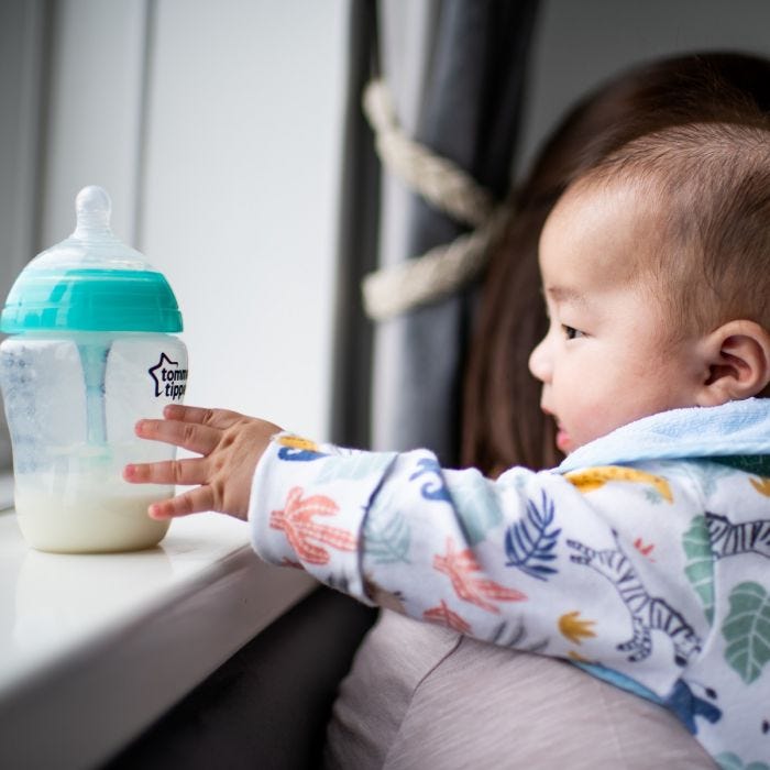 Baby reaching for advanced anti-colic baby bottle