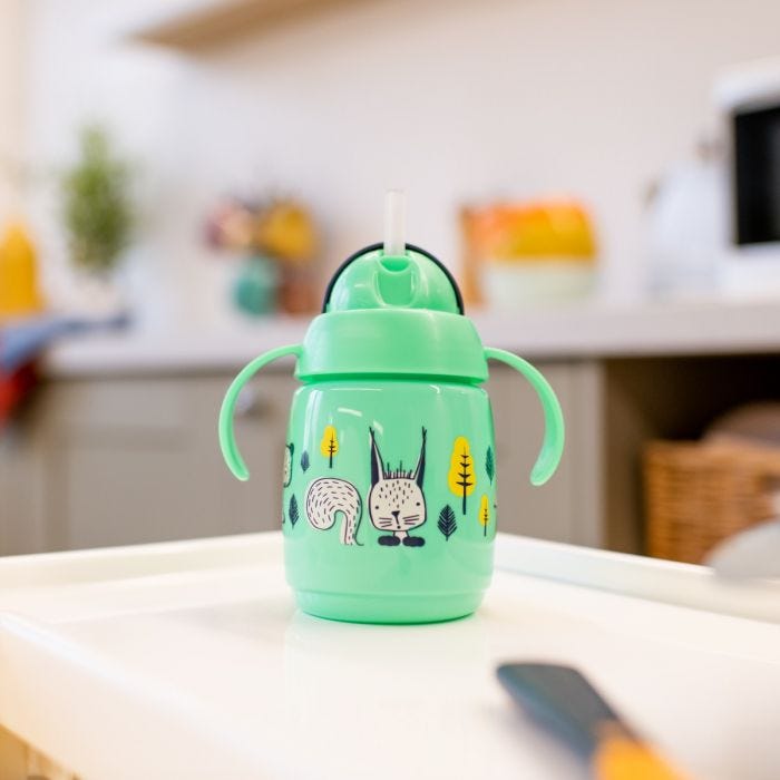 Superstar Weighted Straw Cup, Green on tabletop