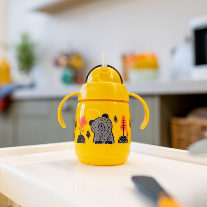 Superstar Weighted Straw Cup, Yellow on tabletop