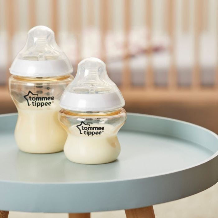 Baby bottle with formula on tha table 