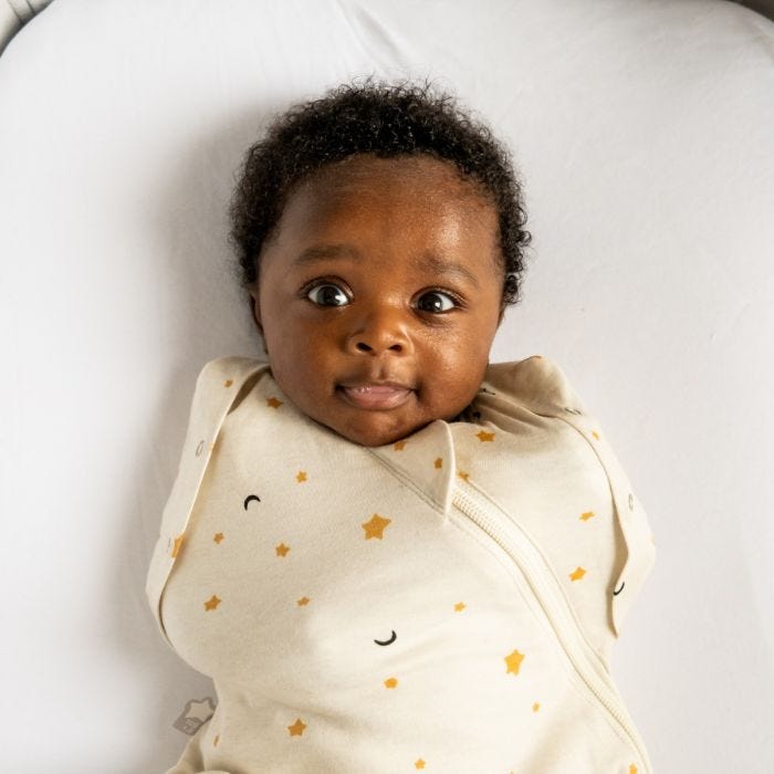 baby being swaddled in The Original Grobag Swaddlebag