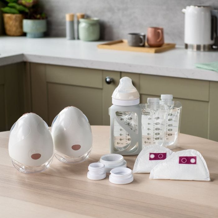 Product imagery of contents of wearable breast pump bundle in a home setting