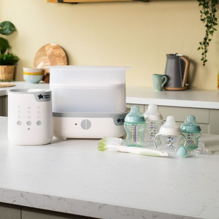 Product imagery of contents of bottle feeding starter bundle in a home setting