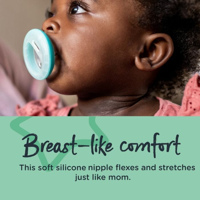 Baby with blue breast-like paciifer in mouth with text stating they offer breast-like comfort.