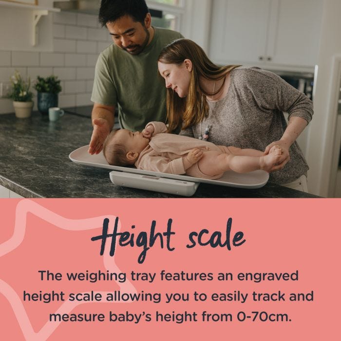 Parents weighing baby on baby weighing scales on kitchen bench. Text describes the engraved height scale.