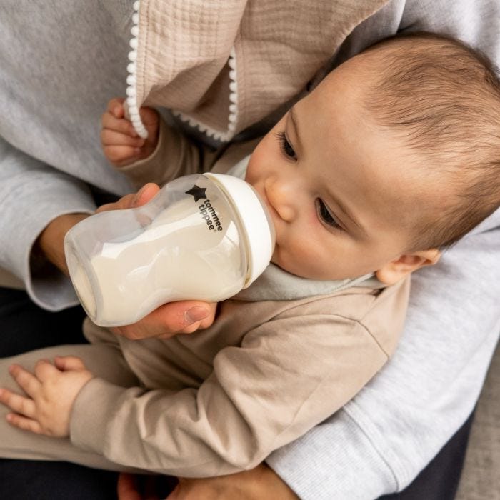 Baby feeding from a Closer to Nature baby bottle.
