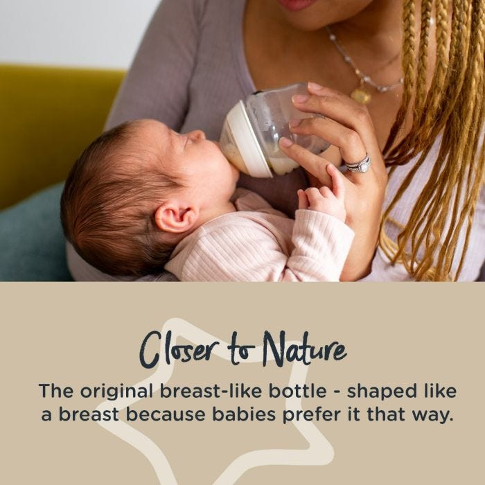 Baby being fed with a Closer to Nature bottle with text stating it’s shaped like a breast because babies prefer it that way.