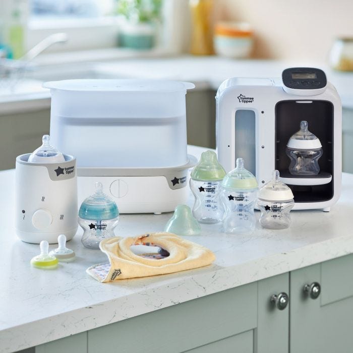 Product image showing the contents of the complete bottle feeding bundle in home setting