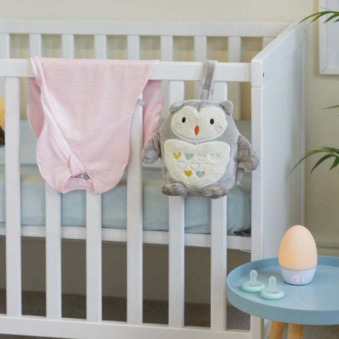 Image of all of the products included in the complete newborn bedtime gift bundle in home setting