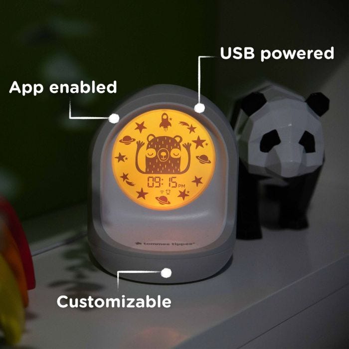 Connected sleep trainer clock with pointers saying it’s app enabled, USB powered and customizable
