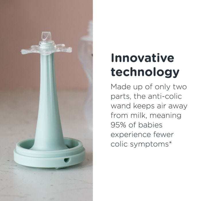 The Advanced Anti-Colic baby bottle wand on a kitchen counter with text about innovative technology