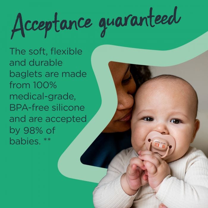Baby sitting on mum’s knee with a pink Anytime soother in their mouth with text stating these soothers are accepted by 98% of babies.