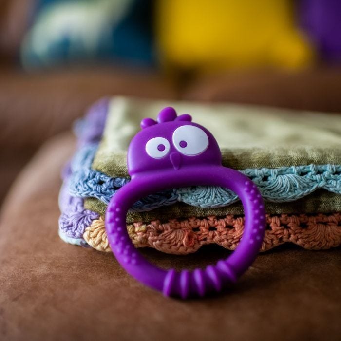 Kalani sensory mini teether on chair