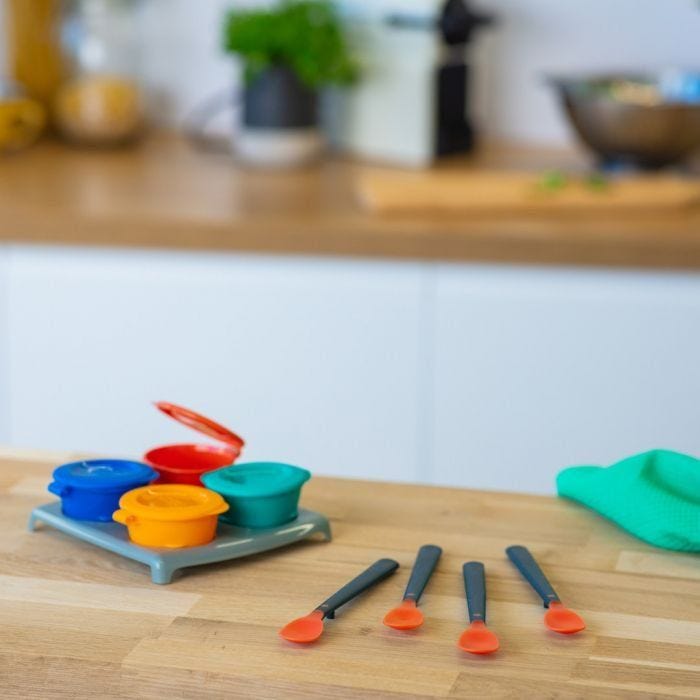 Heat sense soft weaning spoons on kitchen table 