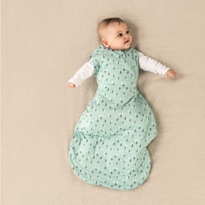 baby wearing Tommee Tippee treasure trees snuggle with both arms extended