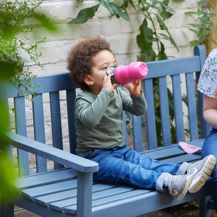 Child holding Insulated Sippee Bottles 