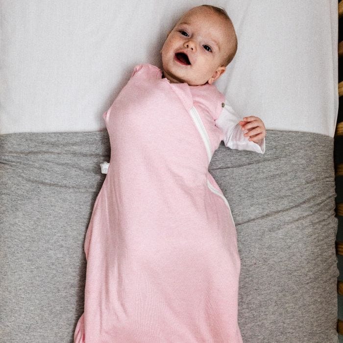Baby wearing The Original Grobag Pink Marl Snuggle