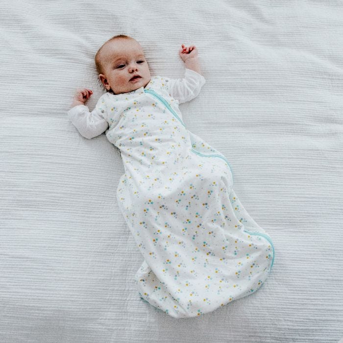 Baby wearing The Original Grobag Baby Stars Snuggle