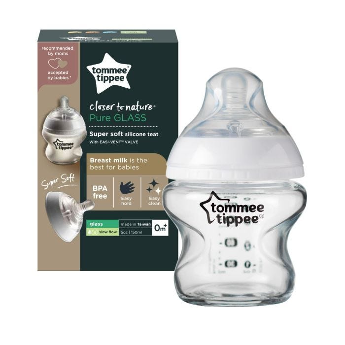 Glass baby bottle with its packaging box against a white background