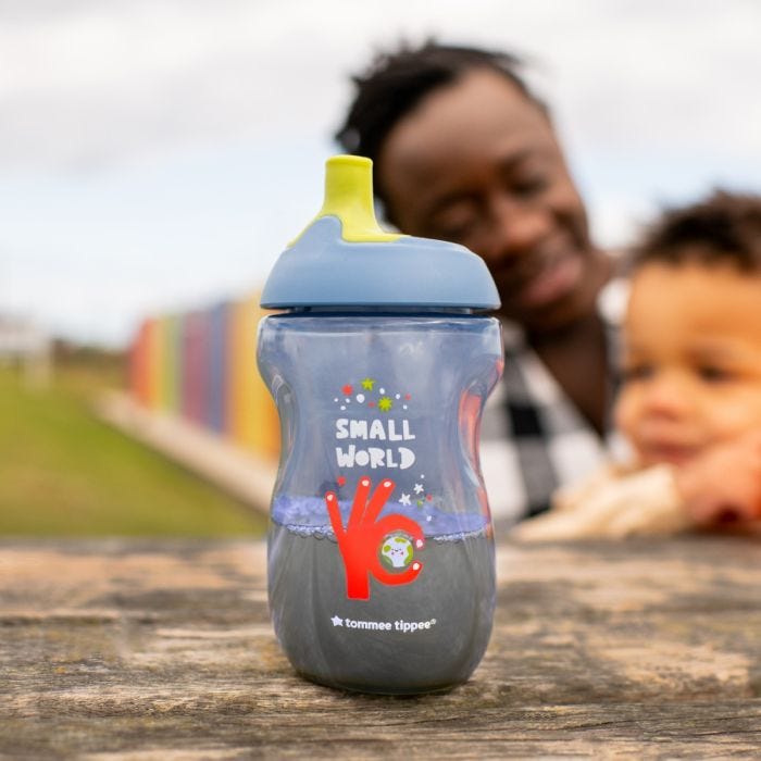Blue sportee bottle on picnic table