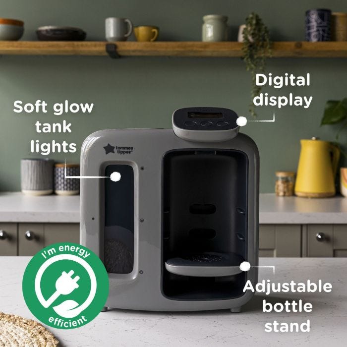 Grey Perfect Prep machine on kitchen counter with pointers to its tank lights, digital display and adjustable bottle stand