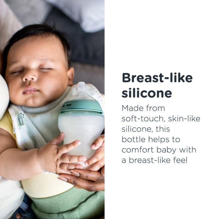Baby asleep in mother’s arms while holding his Natural Start Silicone baby bottle with text about how it has a breast-like feel