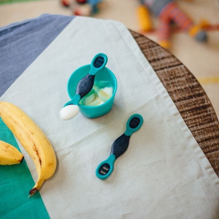 Smushee™- first self-feeding spoon on table overhead shot