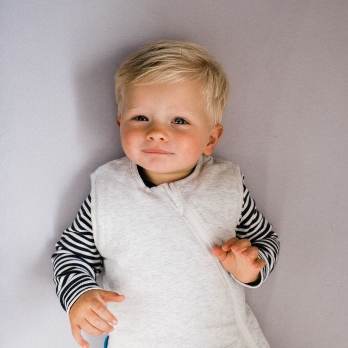Boy wearing The Original Grobag Grey Marl Sleepbag