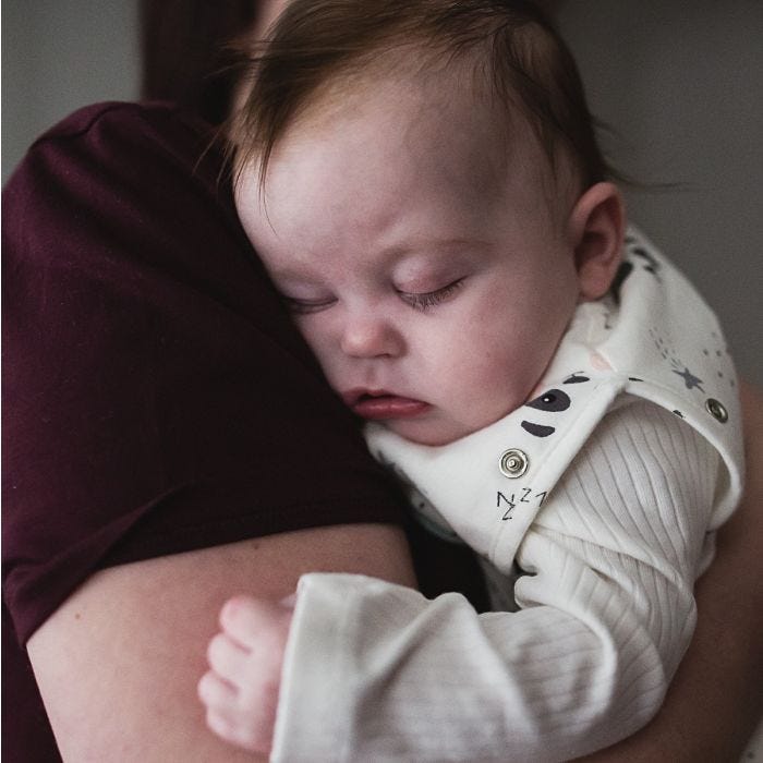 Baby wearing Grey Marl Grobag Snuggle